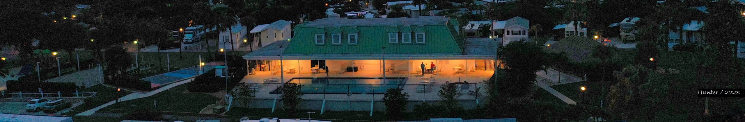 Drone shot of clubhouse with sunset Copy Copy (1)2